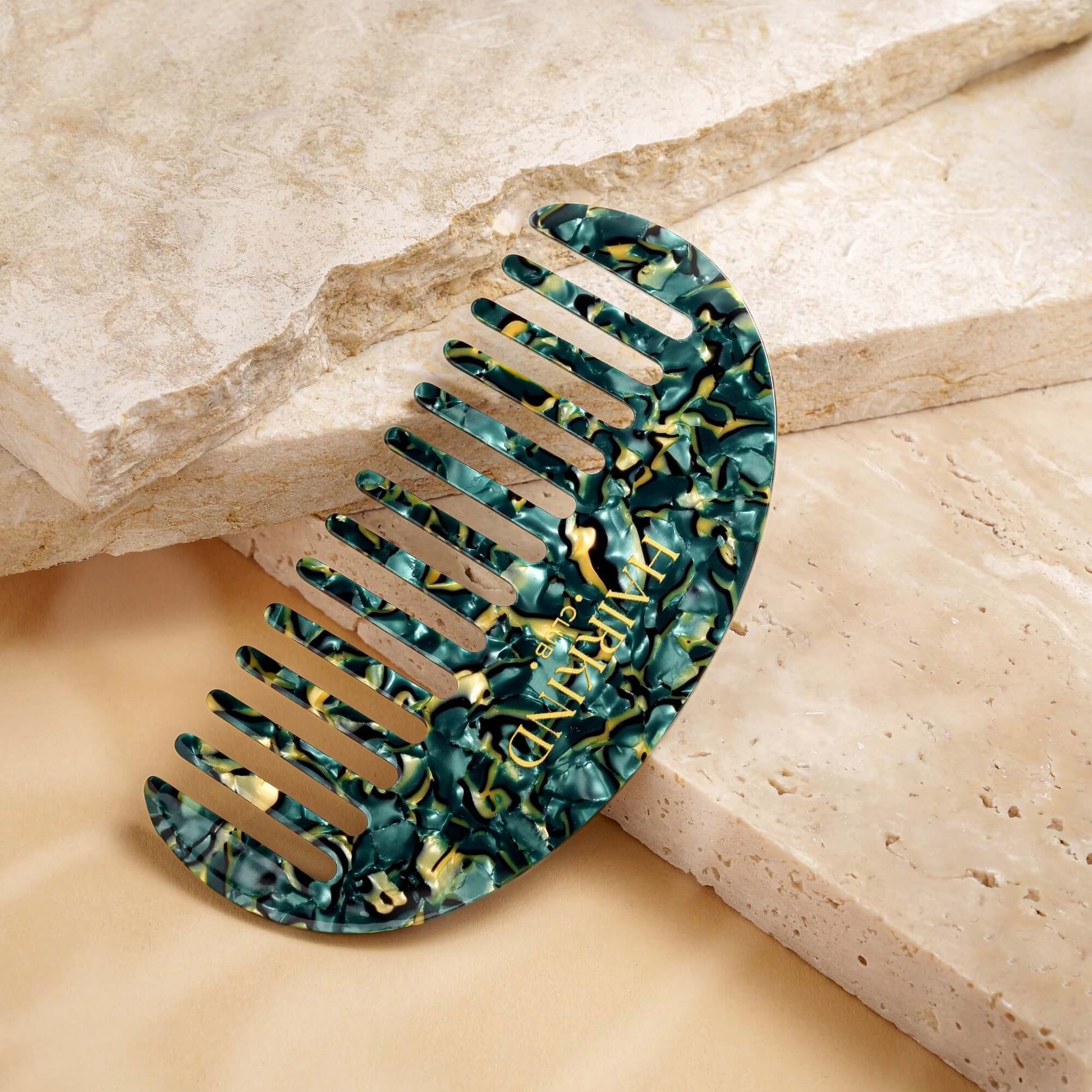 HairKind Scalp Comb close-up showing gentle rounded teeth designed for sensitive scalp massage