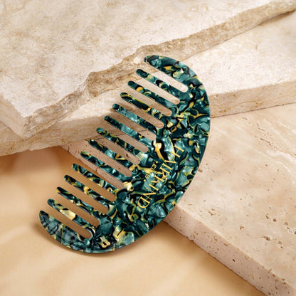 HairKind Scalp Comb close-up showing gentle rounded teeth designed for sensitive scalp massage