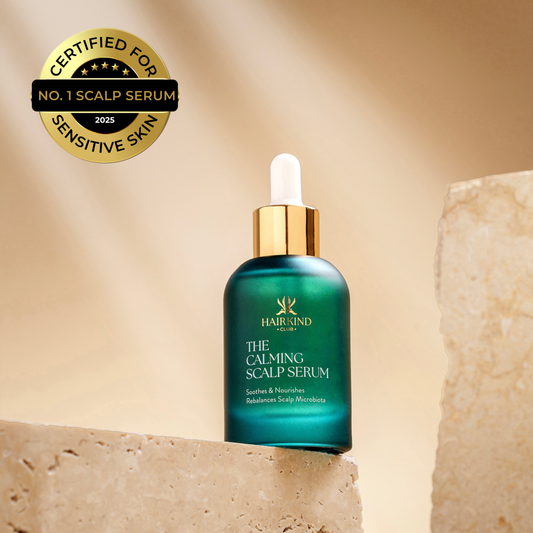 HairKind The Calming Scalp Serum emerald green bottle on stone, certified No.1 for sensitive skin