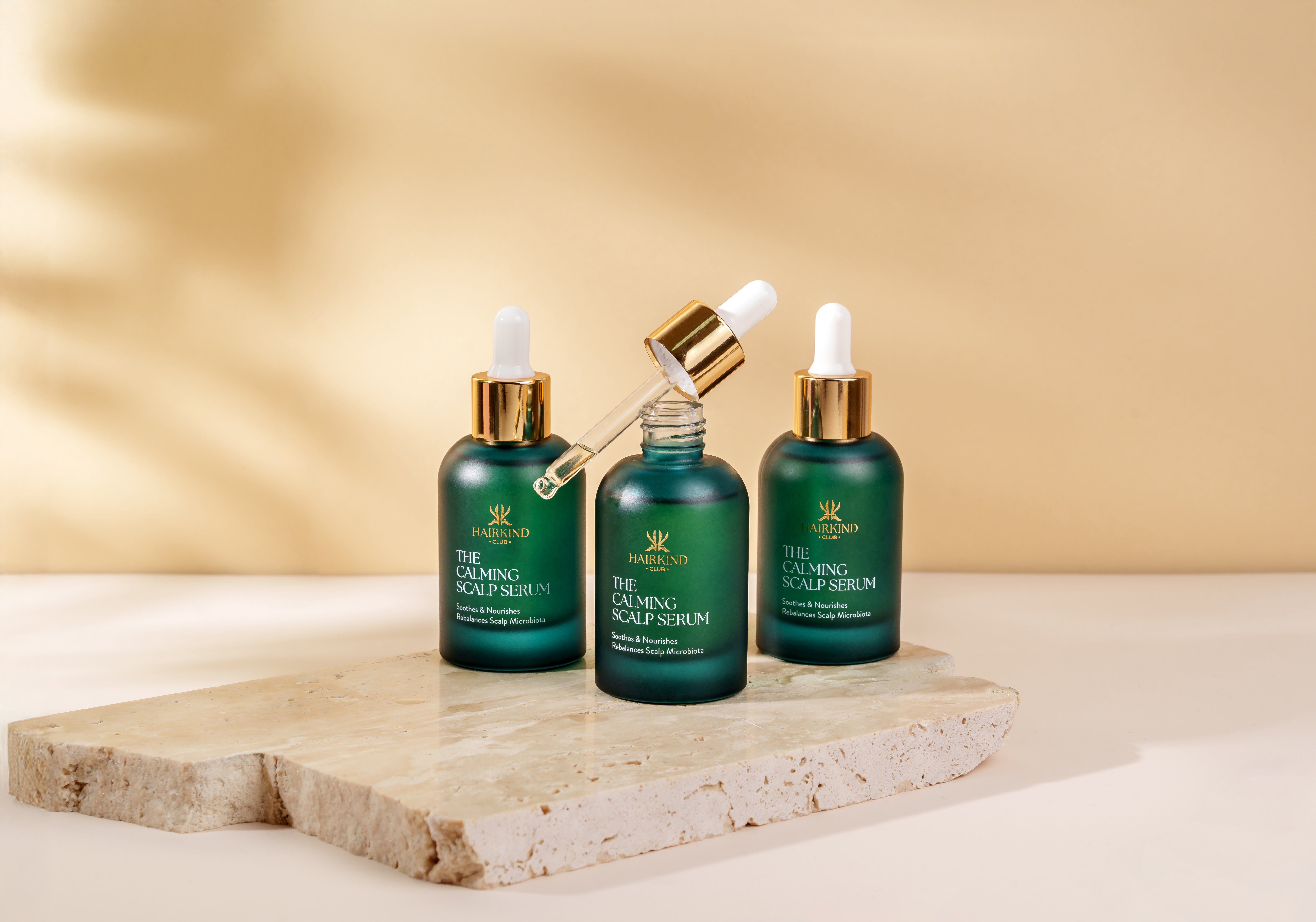 Three bottles of The Calming Scalp Serum