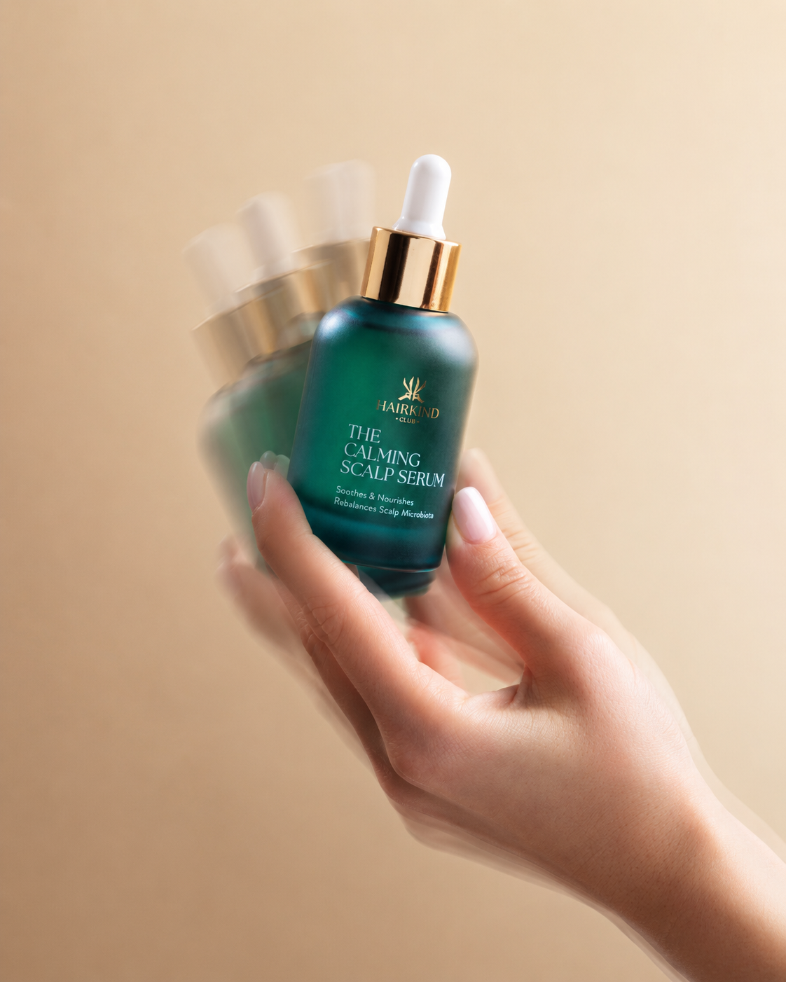 Shaking The Calming Scalp Serum bottle before use